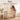 Overview of Boori Natty Ergonomic Cot Bed with mum lifting baby