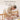 Parent changing baby with Boori Natty Cot Bed drop side lowered