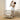 Mother lifting baby near CoZee Breeze Zen bassinet