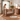 Parent tucking child into Boori Noosa Cot Bed in Pecan room