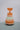 Side view of Trixie Mr. Fox wooden ring stacker showing curved wobble base