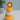 Side view of Trixie Mr. Lion wooden ring stacker showing curved wobble base
